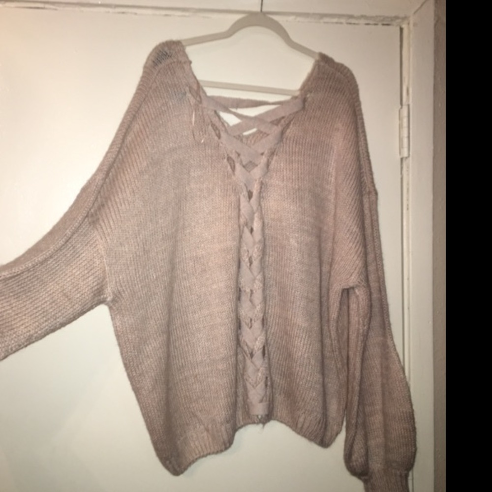 Champagne colored sweater that laces in the back